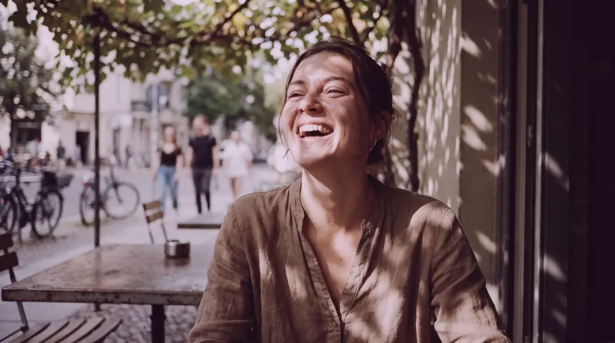 Candid portrait at a streetside cafe in warm afternoon light