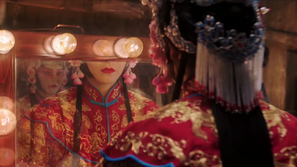6 seconds in: she rises from the mirror in the crimson-and-gold robe